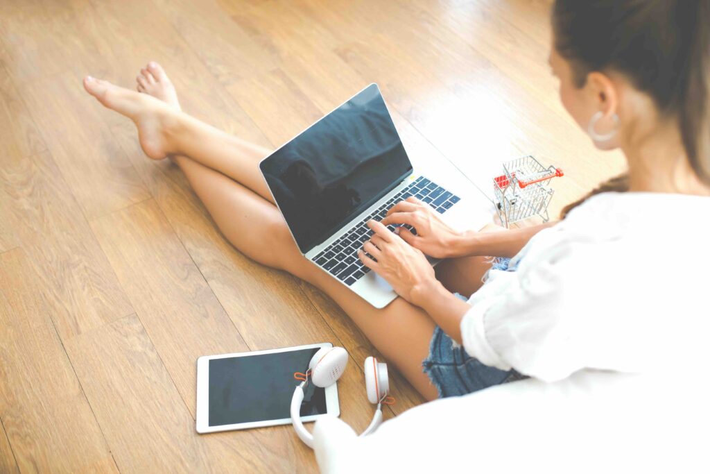 Top view of women use laptop computer for online shopping from home