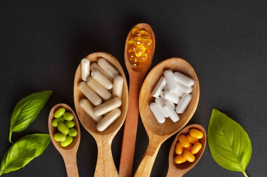 Color Dietary Supplements in Spoon, Vitamin Capsules Mix, Mineral Pills, Healthy Multivitamin Capsule, Naturopathy Concept, Nutritional Tablets, Dietary Supplements Set