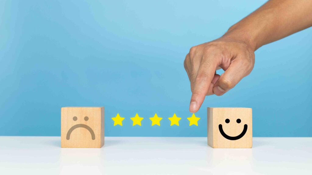 Service rating, satisfaction and positive feedback concept. Customer choose five star slide bar with smile face emoticon indicates satisfaction for the rating