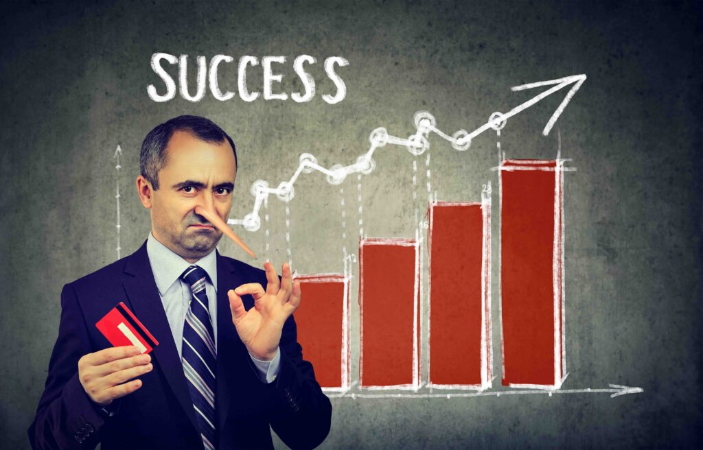 Financial fraud concept. Liar dishonest businessman holding a credit card with big growing Pinocchio nose making a promise of financial success